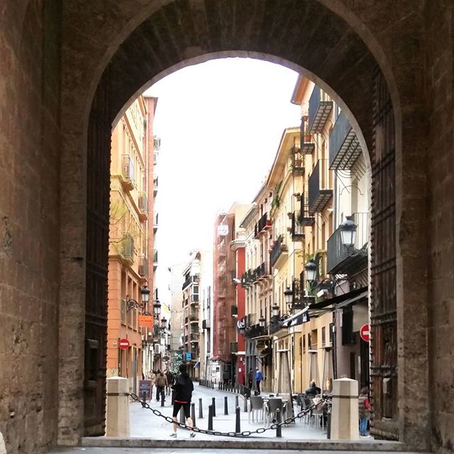 A woman jogging through Porta de Serrans, Valencia, Spain. Built in the 14th century, it's considered to be the entrance to the city and has been used for various purposes including defense, imprisonment and ceremonies.

#jogger #portadeserrans #torresdeserrano #romanarch #limestone
#valencia #spain #espanha #espanya 
#lovevalencia #instavalencia #igersvalencia #shotsofspain