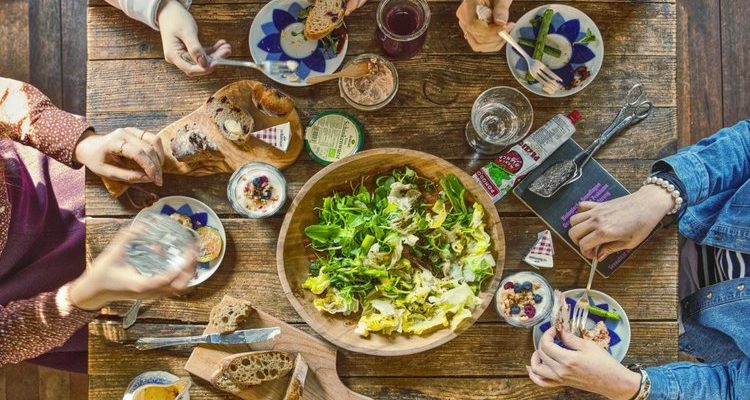 Wooden Table with Vegetarian Food and Salad