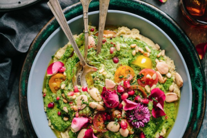 Bowl of green Vegan Food with flowers in Valencia, Spain